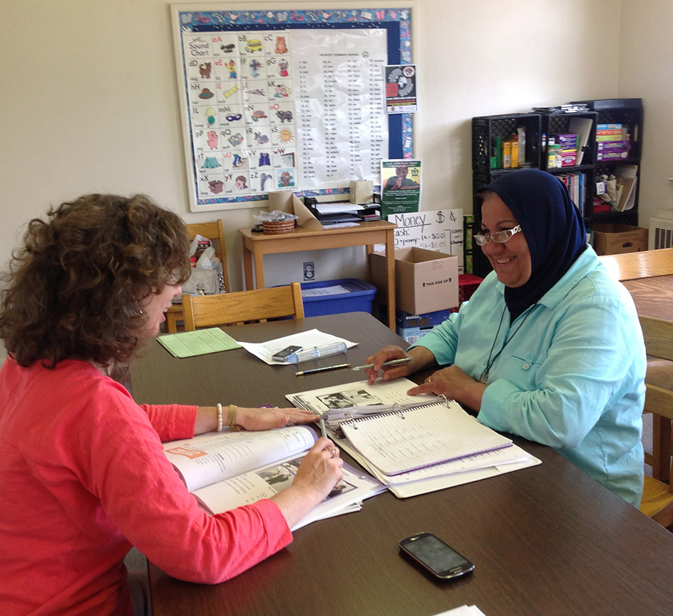 Learning-Literacy American Woman Teaching Refugee