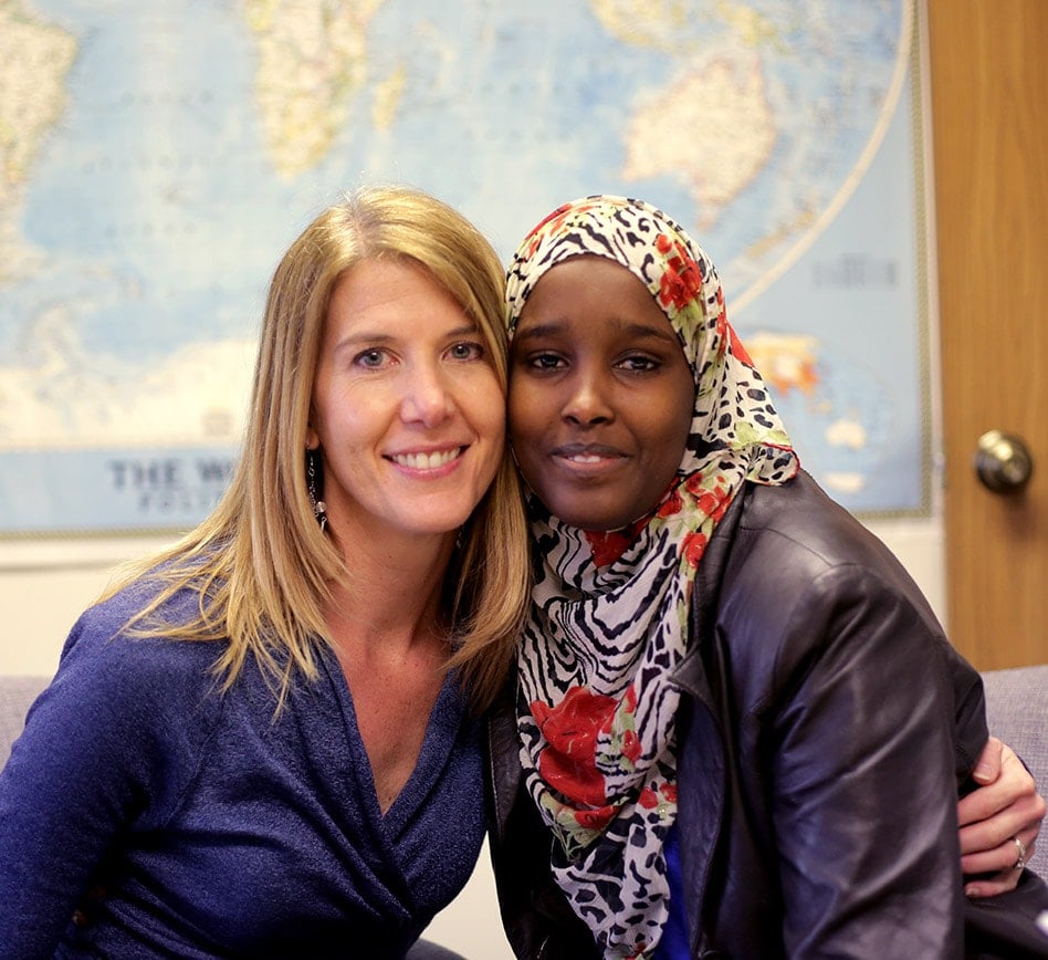 Love-Your-Neighbor-Like-Jesus Woman Hugging Refugee