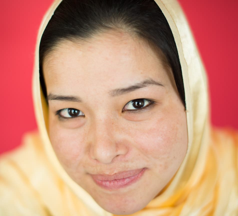 We-Are-Here-To-Help Migrant Woman in Hijab